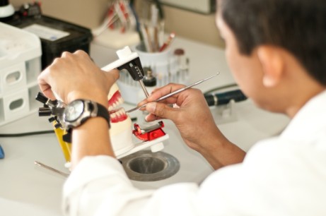 Dentist Working on Dentures
